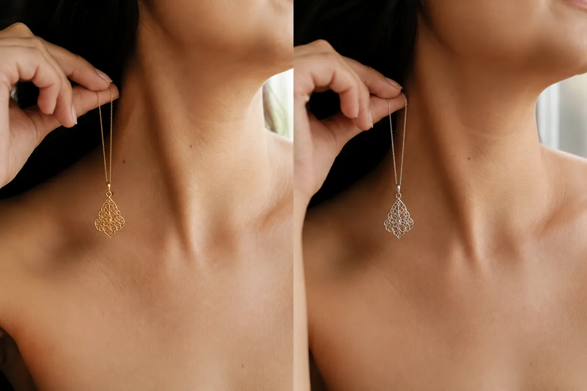 Woman comparing a gold and a silver Persian necklace against her skin tone in natural light